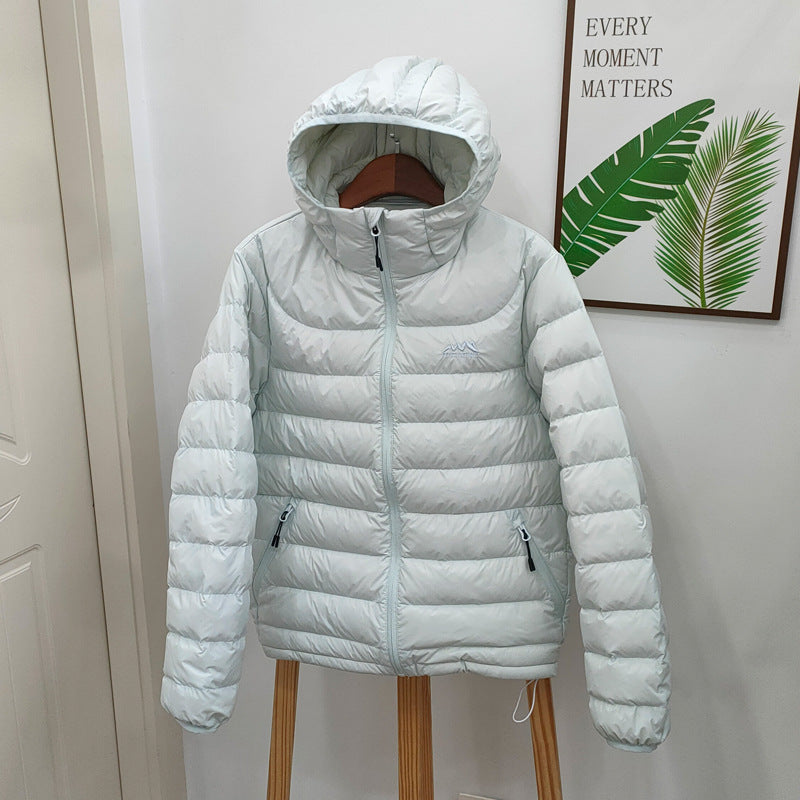 Light women's down jacket with hood, quilted