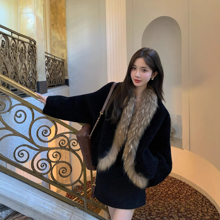 Lamb fleece coat with raccoon fur collar