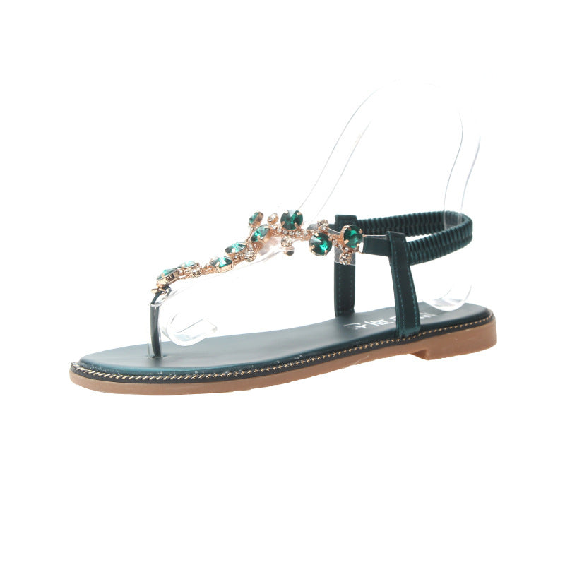 Women's flat T-strap sandals with sparkly jewelry chain, elastic heel strap, and padded footbed Mune Fashion