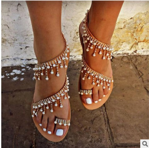 Women's opulent pearl strap sandals with hanging decorative trim, delicate toe strap, and padded comfort footbed Mune Fashion