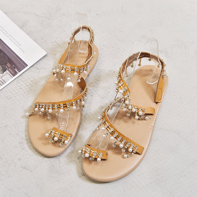 Ladies' filigree ankle strap sandal with sparkling rhinestone and pearl details, toe post, adjustable heel strap, and padded comfort footbed Mune Fashion