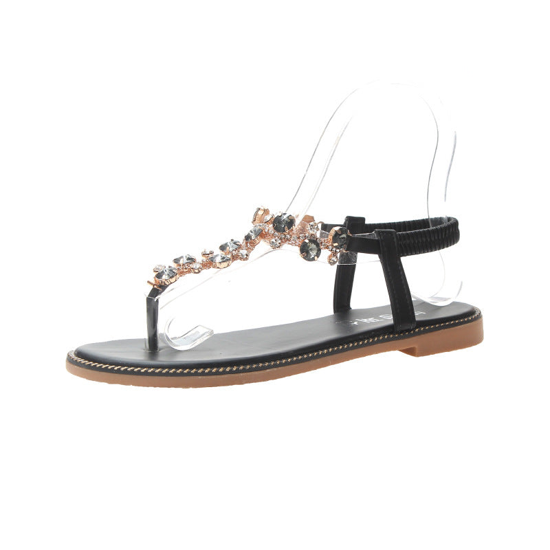 Women's flat T-strap sandals with sparkly jewelry chain, elastic heel strap, and padded footbed Mune Fashion