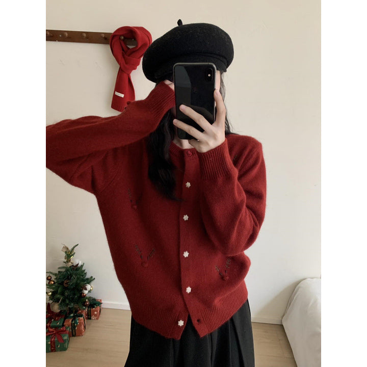 Festive knitted sweater with reindeer embroidery