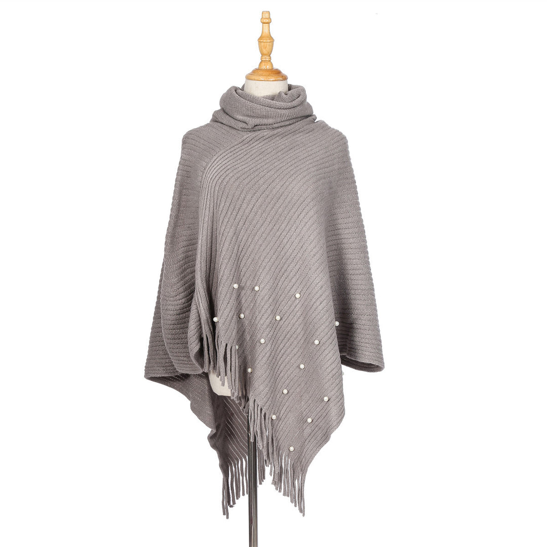 Ladies fine knit poncho with roll neck, bead appliqué and fringe hem Mune Fashion