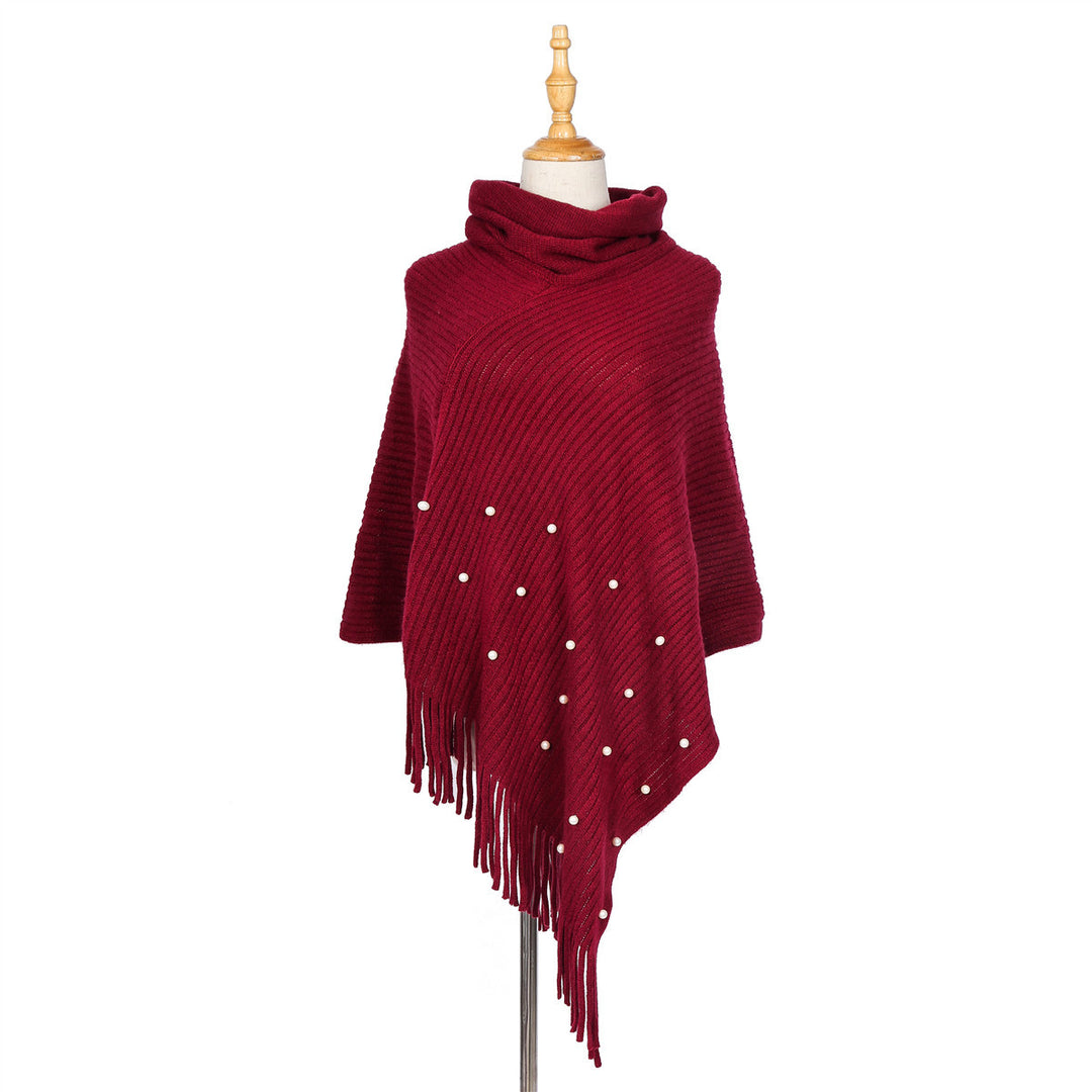 Ladies fine knit poncho with roll neck, bead appliqué and fringe hem Mune Fashion