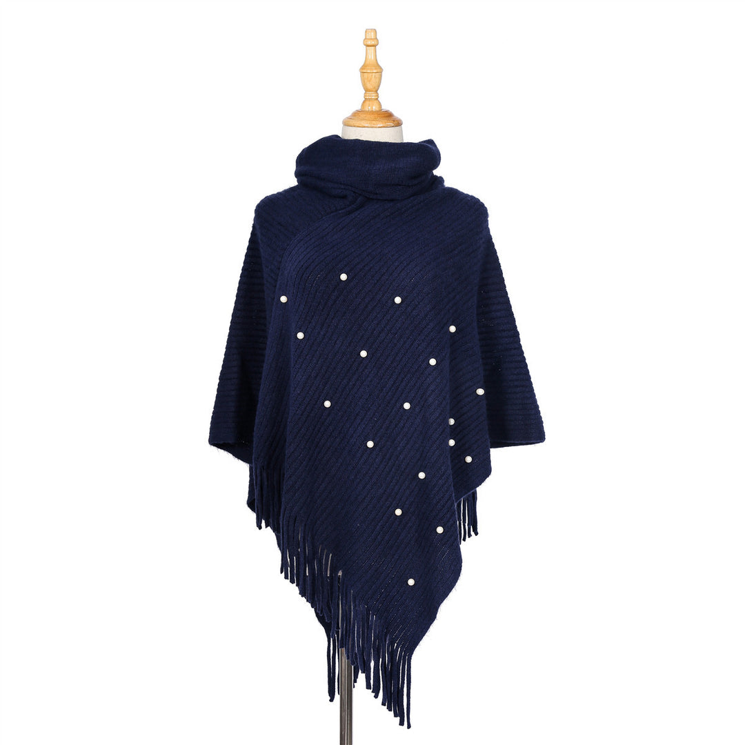 Ladies fine knit poncho with roll neck, bead appliqué and fringe hem Mune Fashion