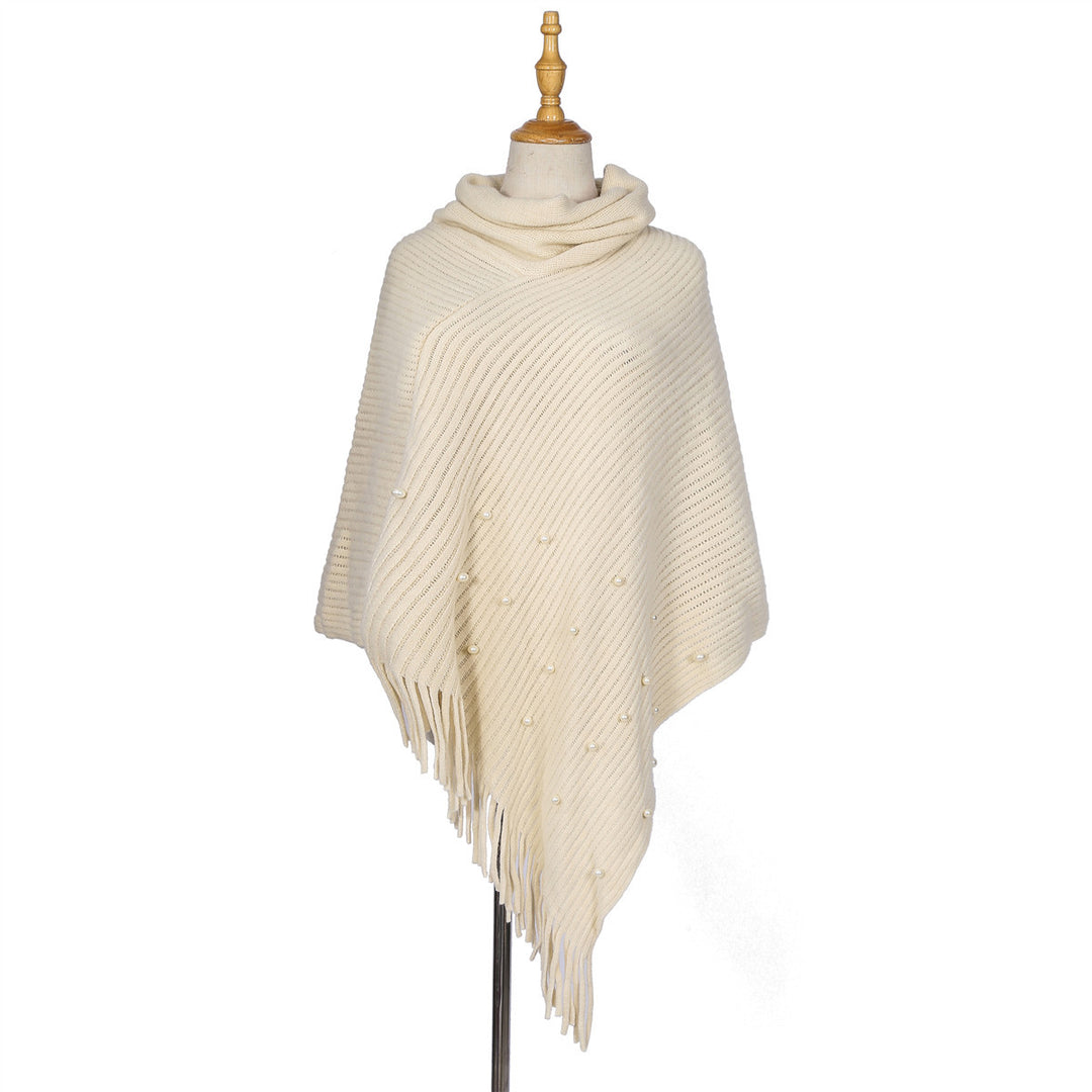 Ladies fine knit poncho with roll neck, bead appliqué and fringe hem Mune Fashion