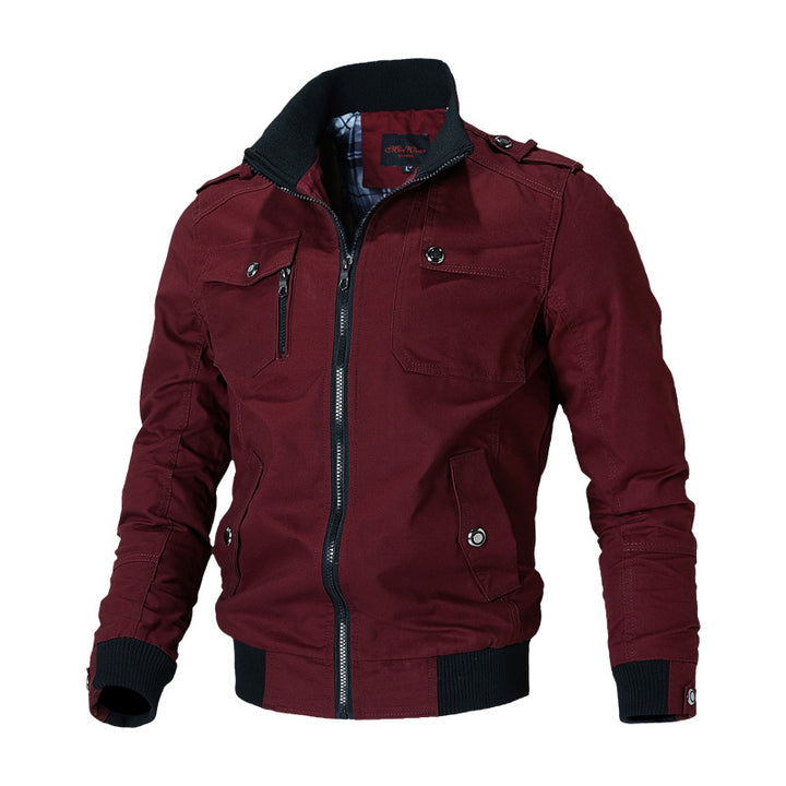Men's urban canvas bomber jacket with ribbed cuffs, stand-up collar, and multiple chest pockets.