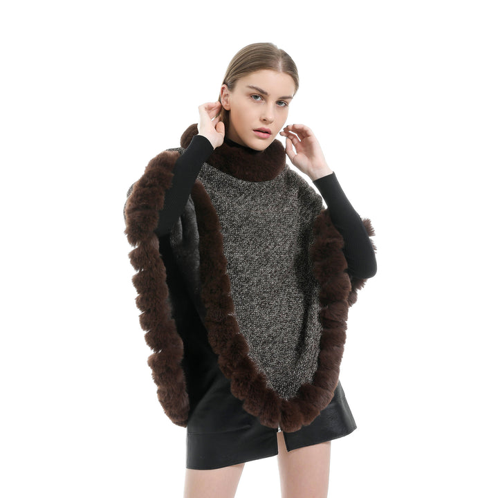 Women's finely knitted ruana poncho with faux fur trim and asymmetric hem Mune Fashion
