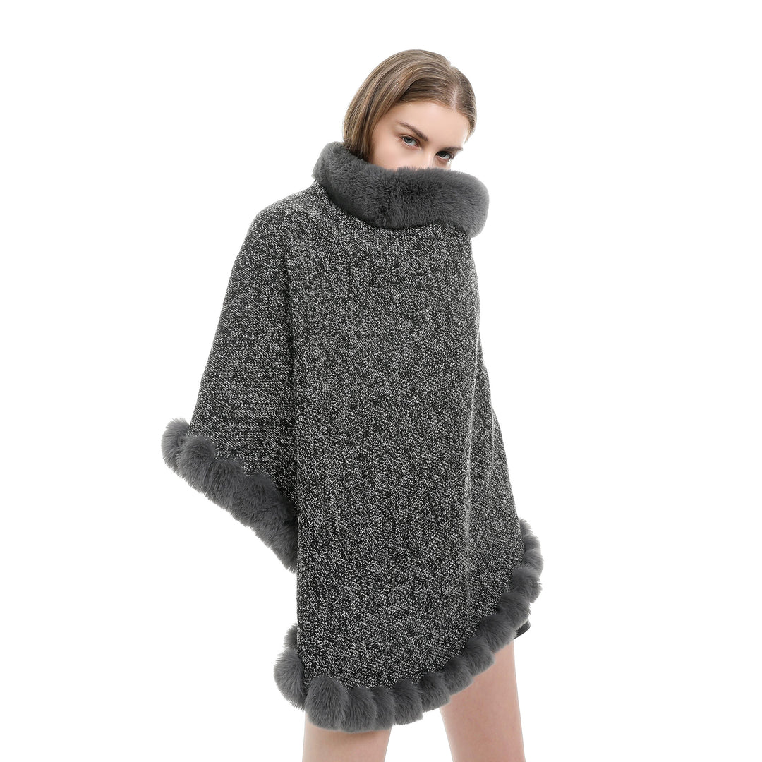 Women's finely knitted ruana poncho with faux fur trim and asymmetric hem Mune Fashion