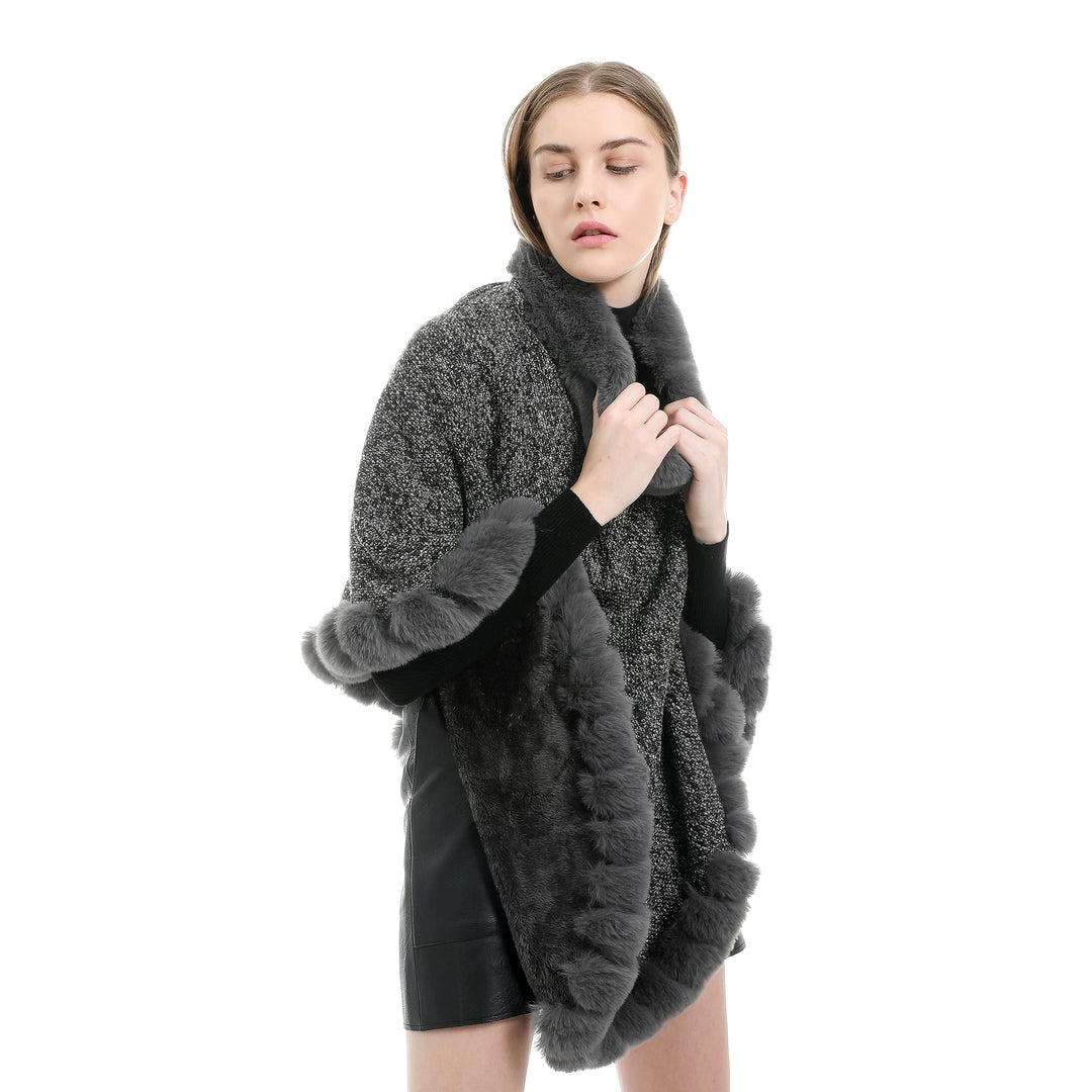 Women's finely knitted ruana poncho with faux fur trim and asymmetric hem Mune Fashion