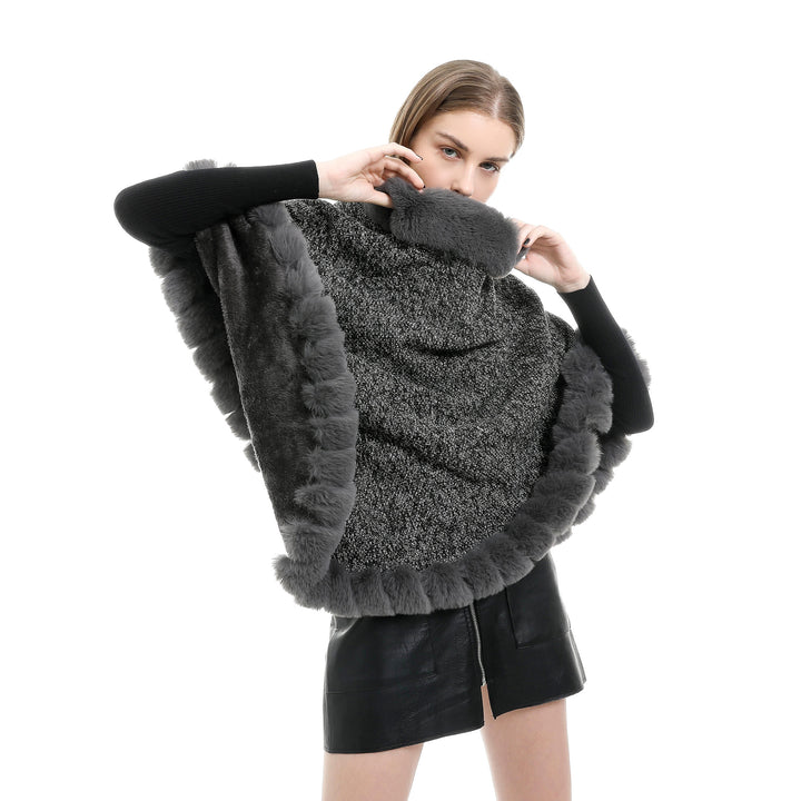 Women's finely knitted ruana poncho with faux fur trim and asymmetric hem Mune Fashion