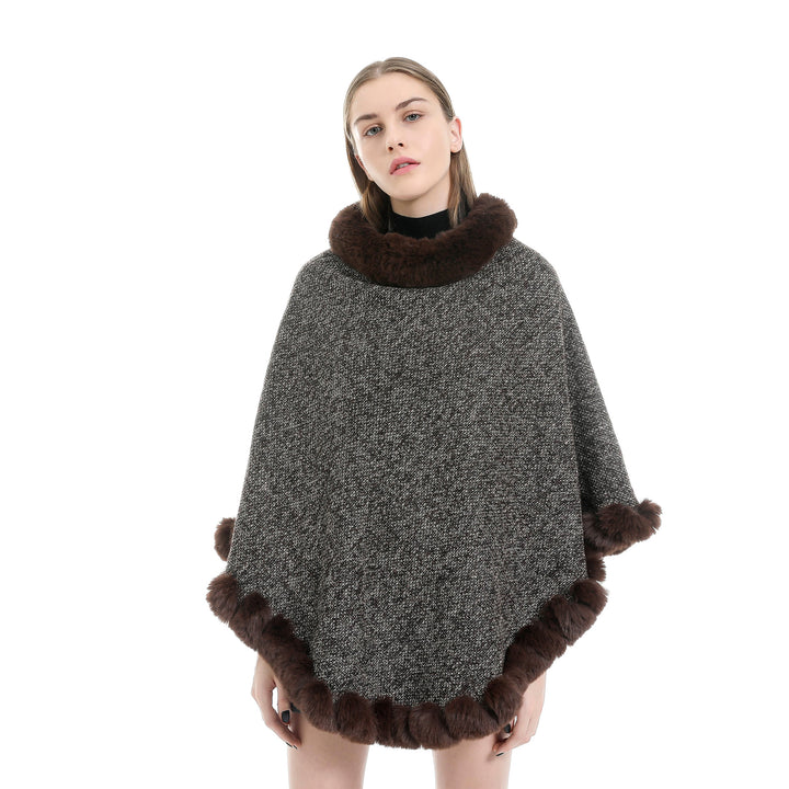 Women's finely knitted ruana poncho with faux fur trim and asymmetric hem Mune Fashion