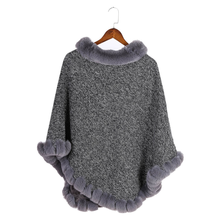 Women's finely knitted ruana poncho with faux fur trim and asymmetric hem Mune Fashion