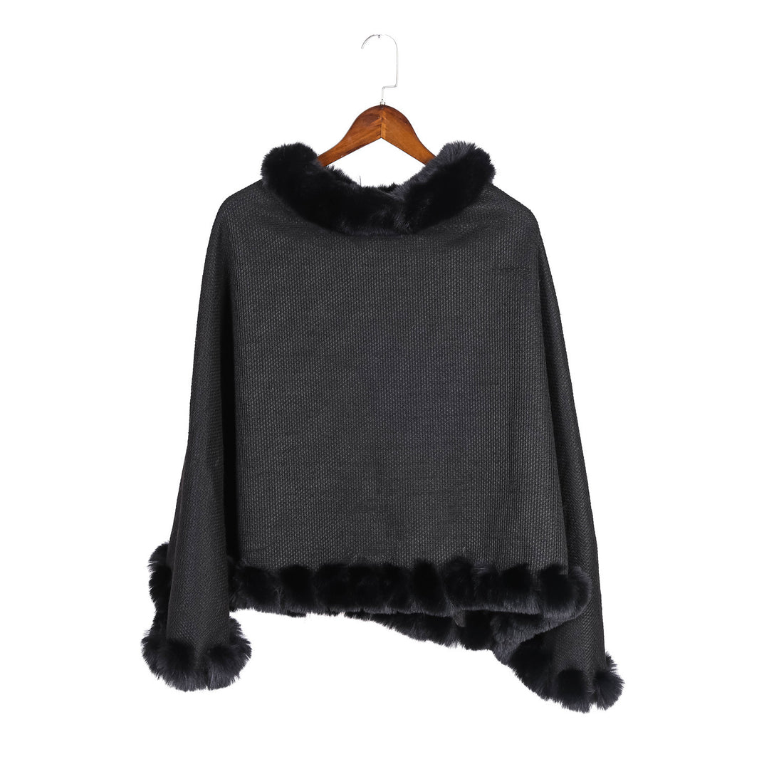 Women's finely knitted ruana poncho with faux fur trim and asymmetric hem Mune Fashion