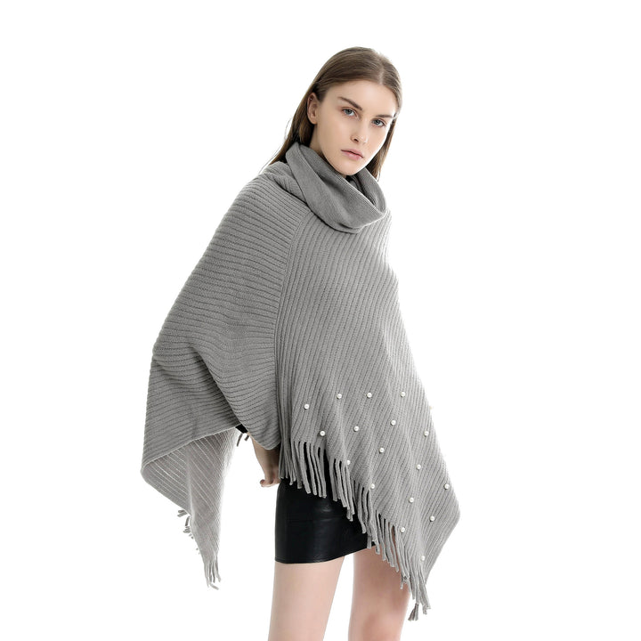 Ladies fine knit poncho with roll neck, bead appliqué and fringe hem Mune Fashion