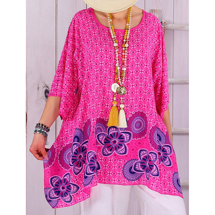 Women's flowing viscose blend tunic in Boho style with floral trim, asymmetrical hem, and 3/4 sleeves Mune Fashion