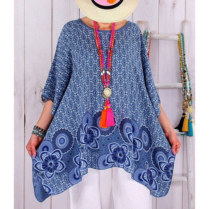 Women's flowing viscose blend tunic in Boho style with floral trim, asymmetrical hem, and 3/4 sleeves Mune Fashion