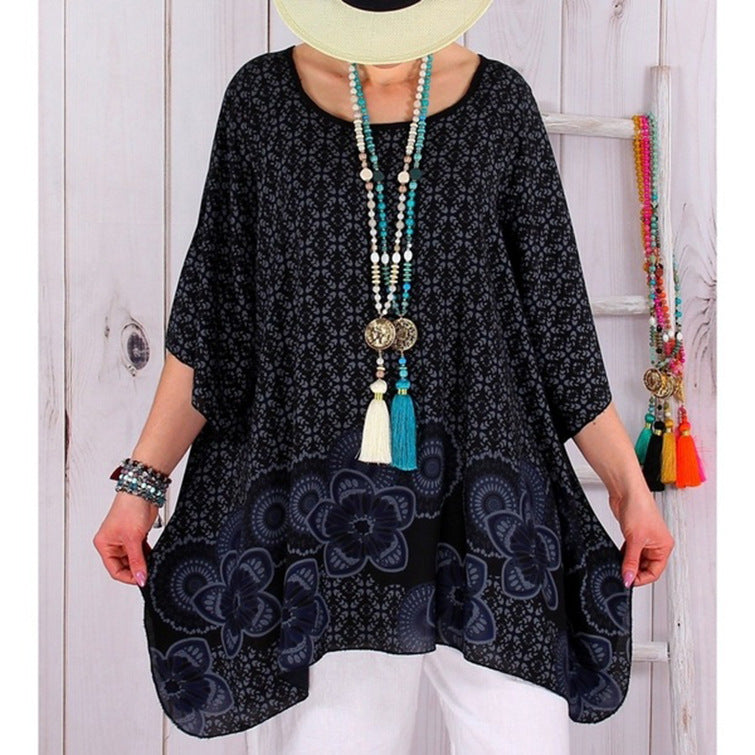 Women's flowing viscose blend tunic in Boho style with floral trim, asymmetrical hem, and 3/4 sleeves Mune Fashion
