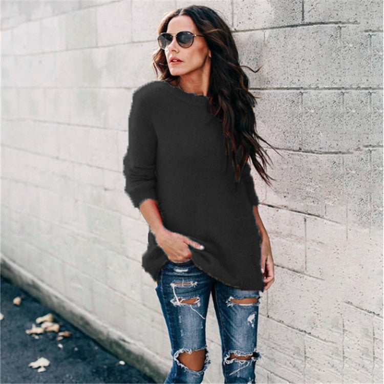 Women's cozy oversized knit sweater with round neckline, high-low hem, and side slits Mune Fashion