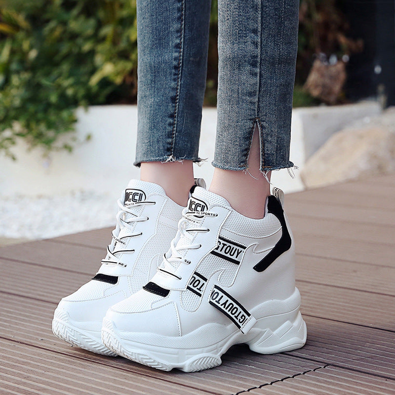Women’s ankle-high platform leisure shoe with hidden wedge heel and distinctive decorative straps Mune Fashion