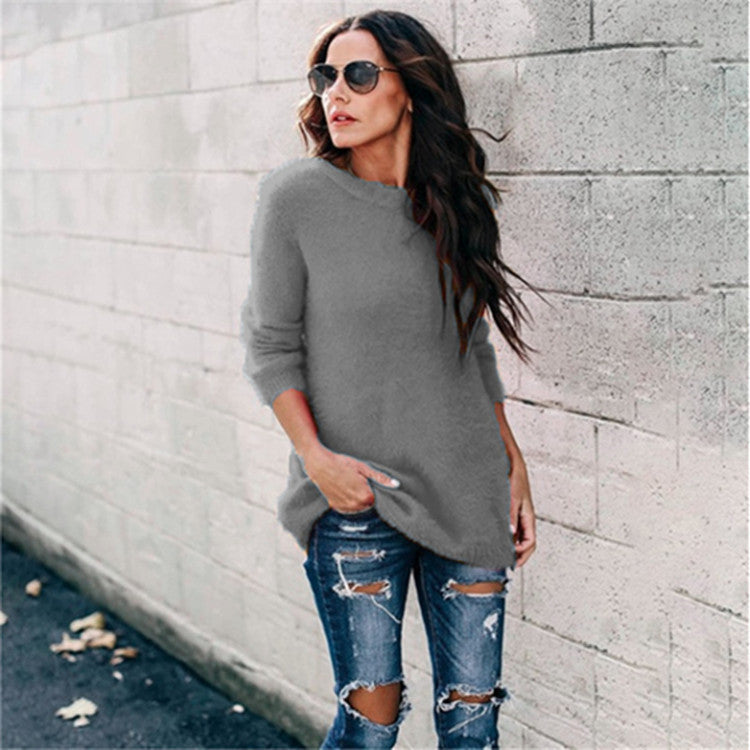 Women's cozy oversized knit sweater with round neckline, high-low hem, and side slits Mune Fashion