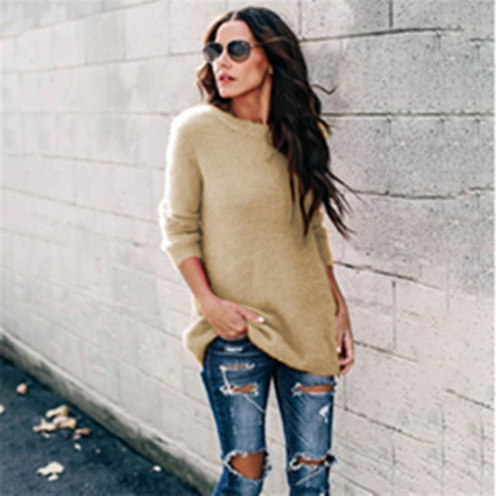 Women's cozy oversized knit sweater with round neckline, high-low hem, and side slits Mune Fashion
