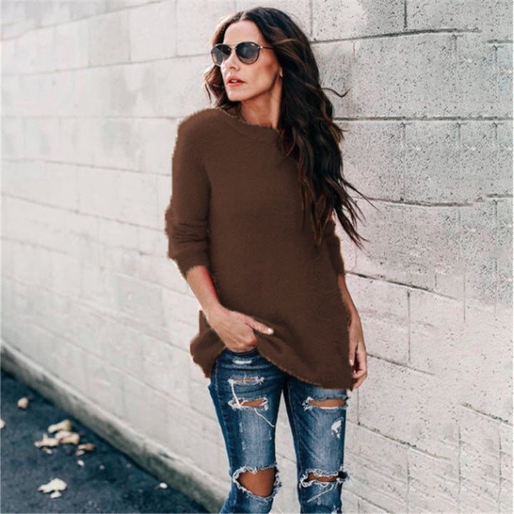 Women's cozy oversized knit sweater with round neckline, high-low hem, and side slits Mune Fashion