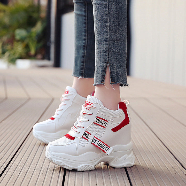 Women’s ankle-high platform leisure shoe with hidden wedge heel and distinctive decorative straps Mune Fashion