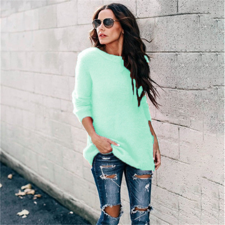 Women's cozy oversized knit sweater with round neckline, high-low hem, and side slits Mune Fashion