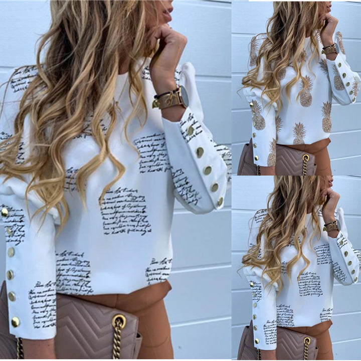 Women round neck blouse made of viscose blend with pineapple print and golden decorative button cuffs Mune Fashion