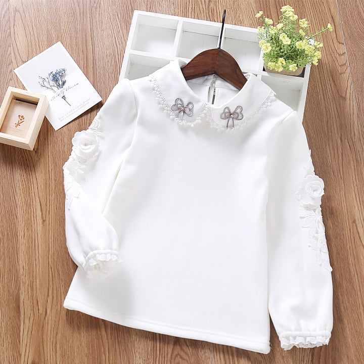 Girls elegant long sleeve blouse with ruffle details and floral accent Mune Fashion