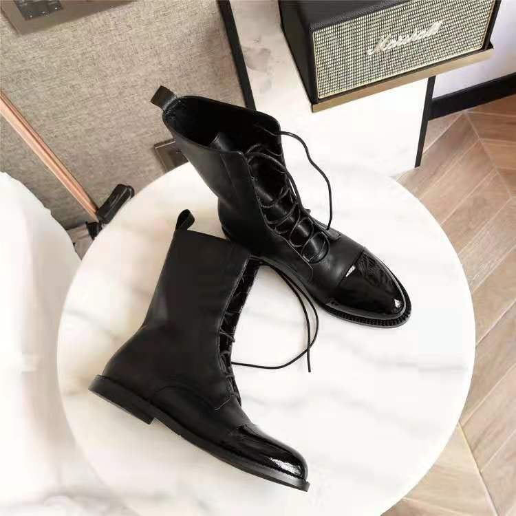 Women's elegant lace-up boots with cap toes, decorated lacing detail, and practical pull loops Mune Fashion