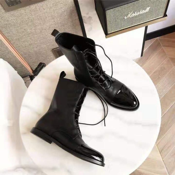 Women's elegant lace-up boots with cap toes, decorated lacing detail, and practical pull loops Mune Fashion