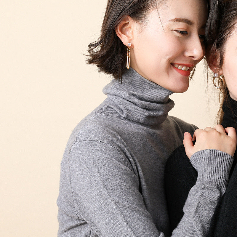 Women's knitted pullover with stand collar and geometric pattern