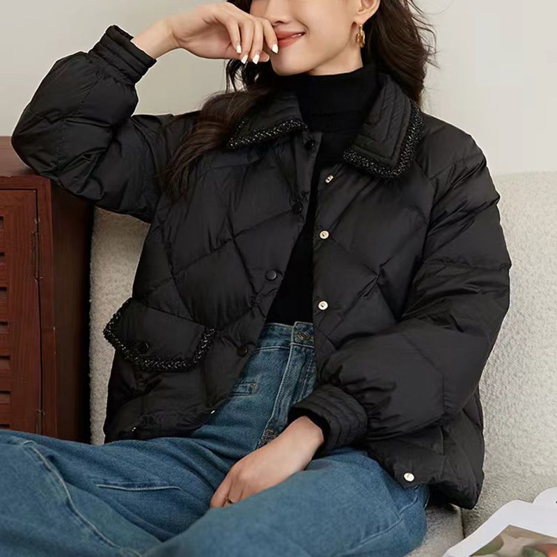 Short women's quilted jacket in diamond design