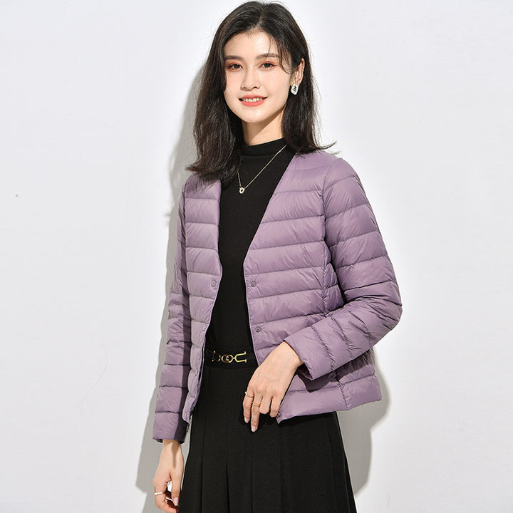 Light women's down jacket, short, as a base layer jacket