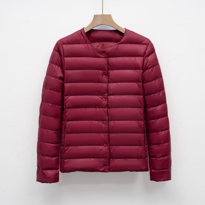 Light women's quilted jacket with round neckline