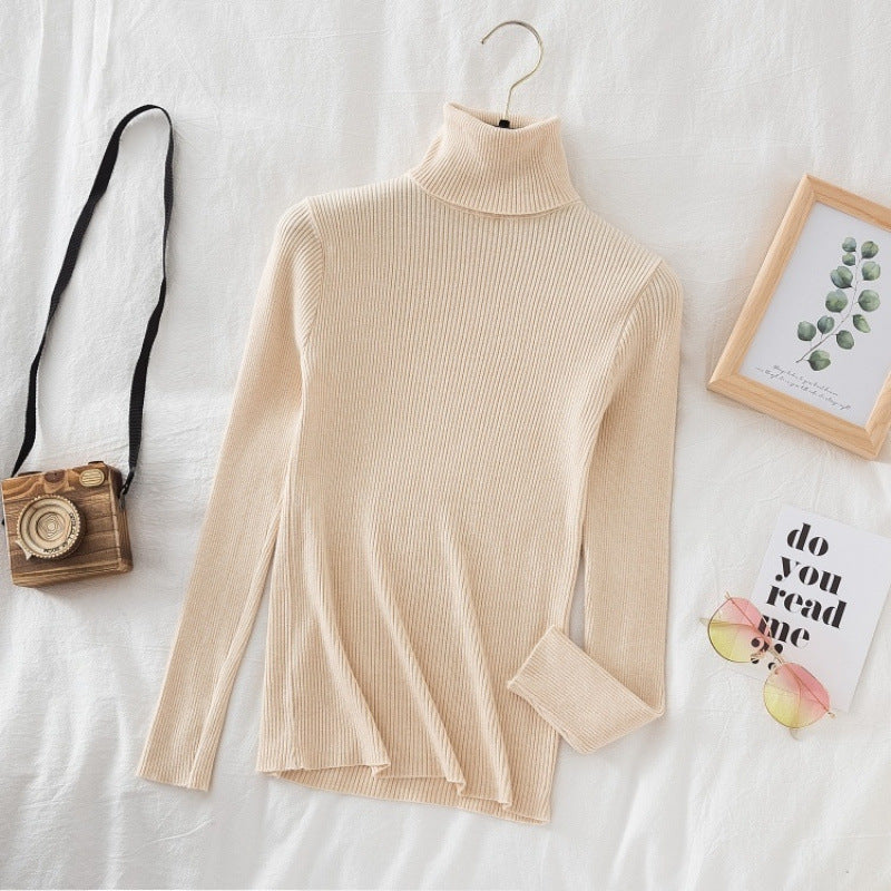 Women's knitted sweater with high collar, fitted