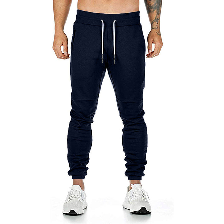Men's tailored tapered joggers with elastic drawstring, cuffs, and zippered pockets Mune Fashion