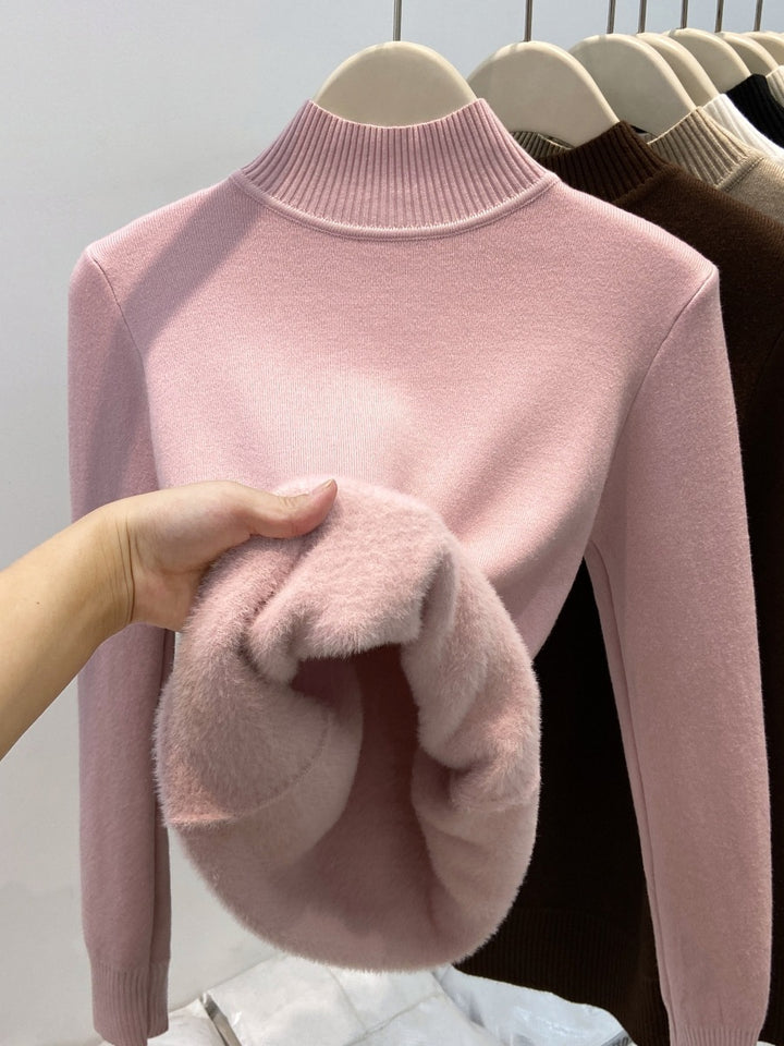 Padded women's knit sweater with high collar