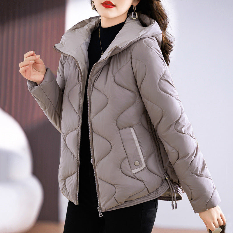 Short women's quilted jacket, glossy, with hood