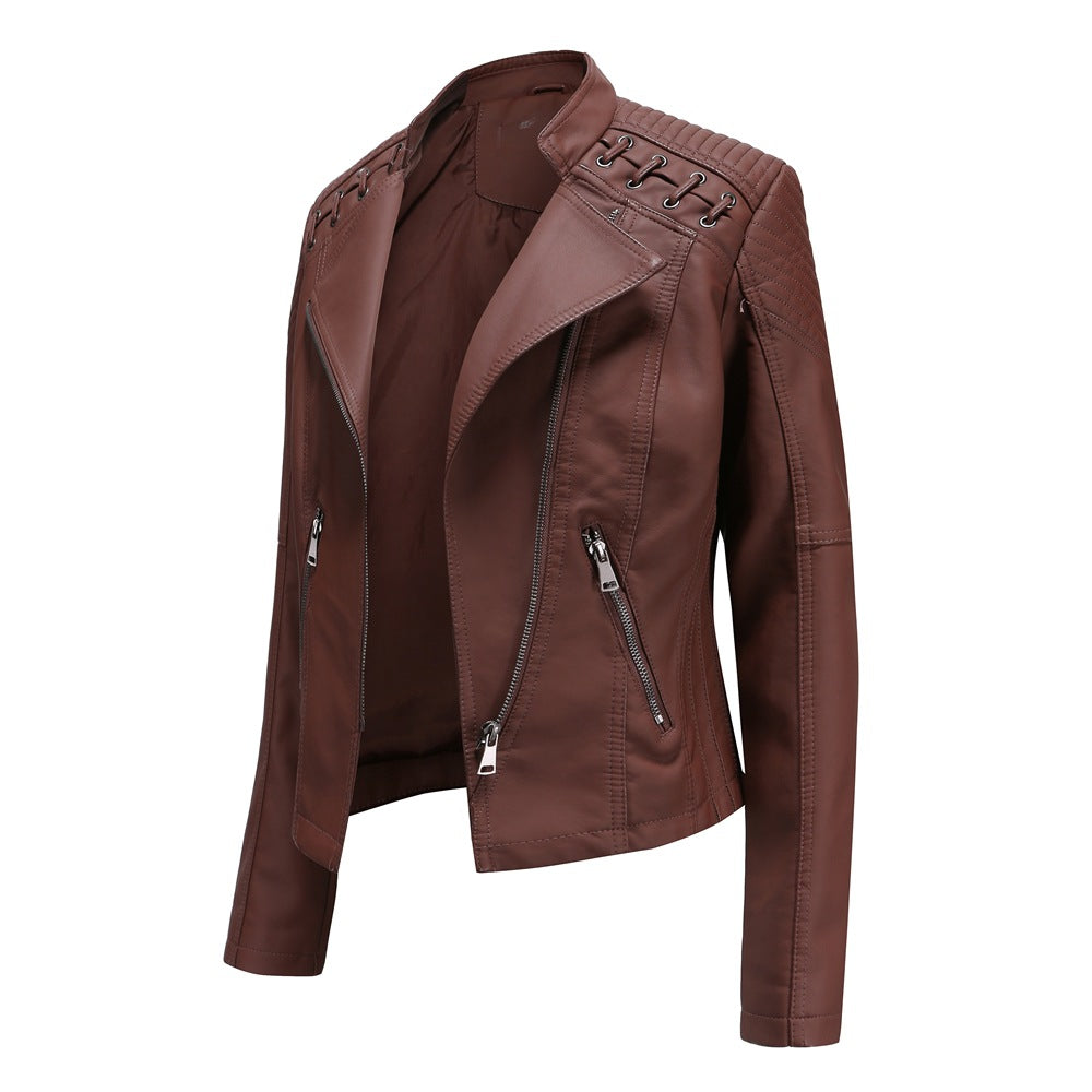 Women's short biker jacket made of faux leather with decorative eyelet lacing on the shoulders Mune Fashion