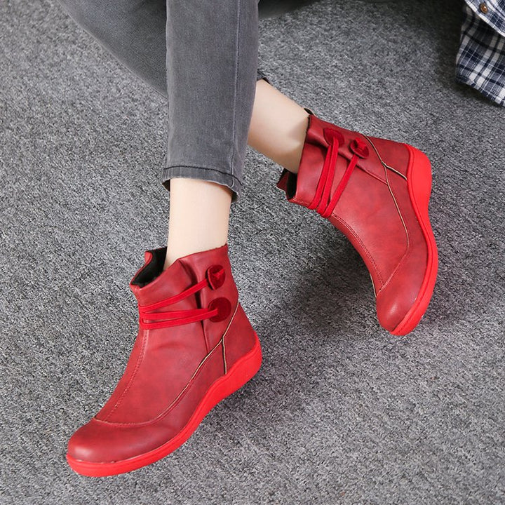 Women's faux-fur-lined ankle boot with ergonomic wedge sole, soft inner lining and decorative loops Mune Fashion