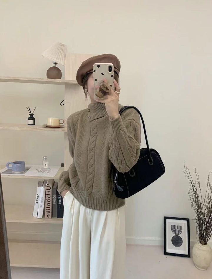 Short cable knit sweater with asymmetric neckline