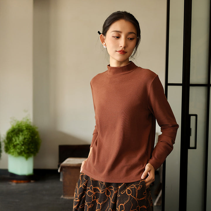 Warm knitted pullover with stand-up collar