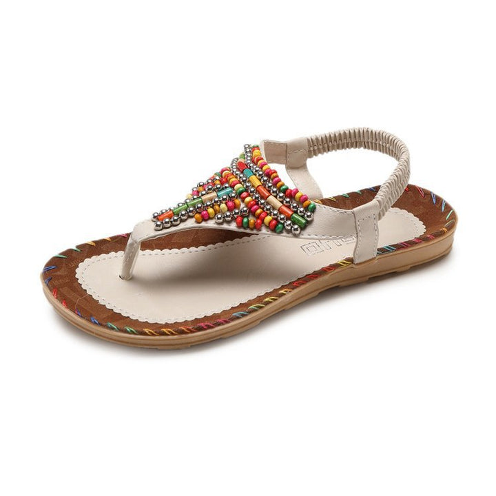 Women's handmade embellished pearl flip-flops with elastic heel strap and stitched decorative seam Mune Fashion