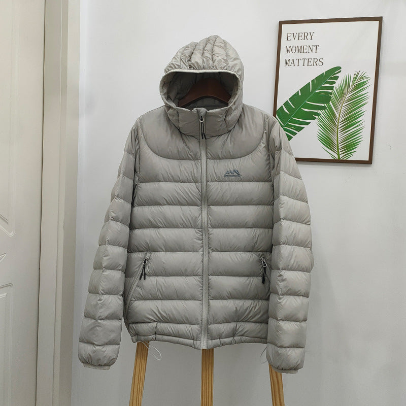 Light women's down jacket with hood, quilted