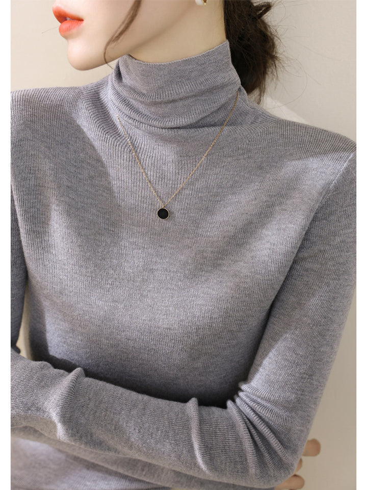 Women's knitted sweater, fitted, with stand-up collar