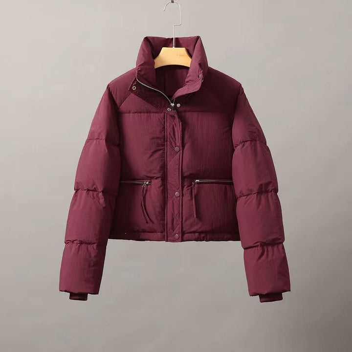 Short women's quilted jacket with stand-up collar